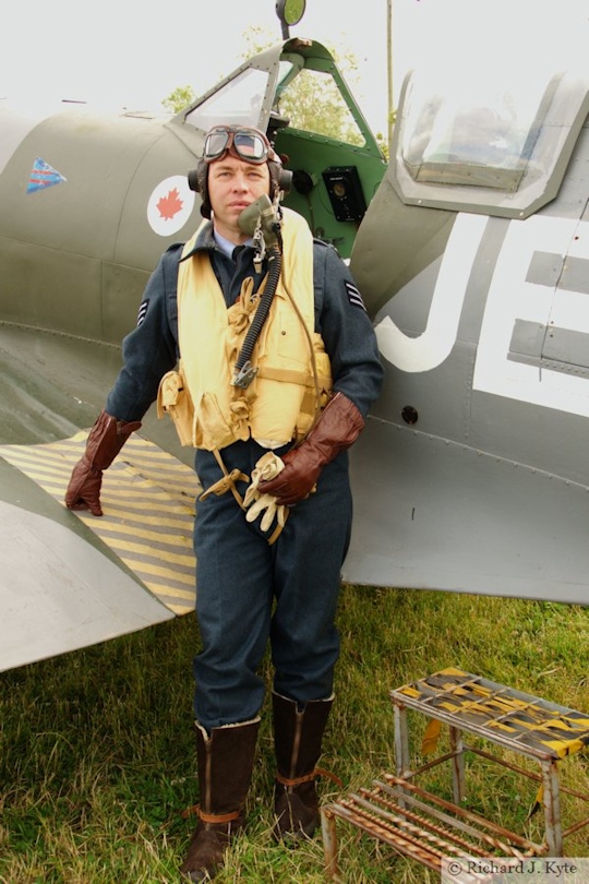 Richard Minney from the Allied Assortment re-enactment, standing by replica Spitfire, Wartime in the Vale 2015