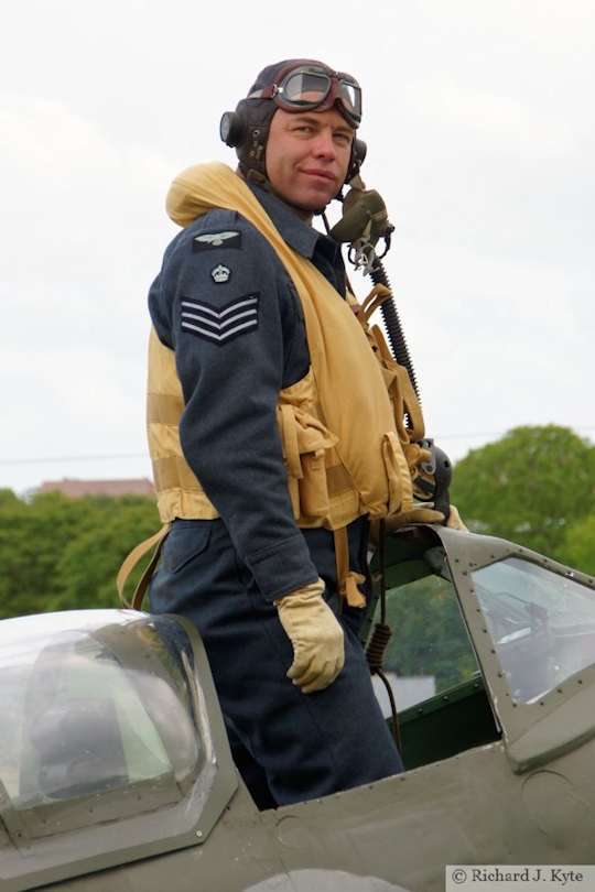 Richard Minney from the Allied Assortment re-enactment, standing in the cockpit replica Spitfire, Wartime in the Vale 2015